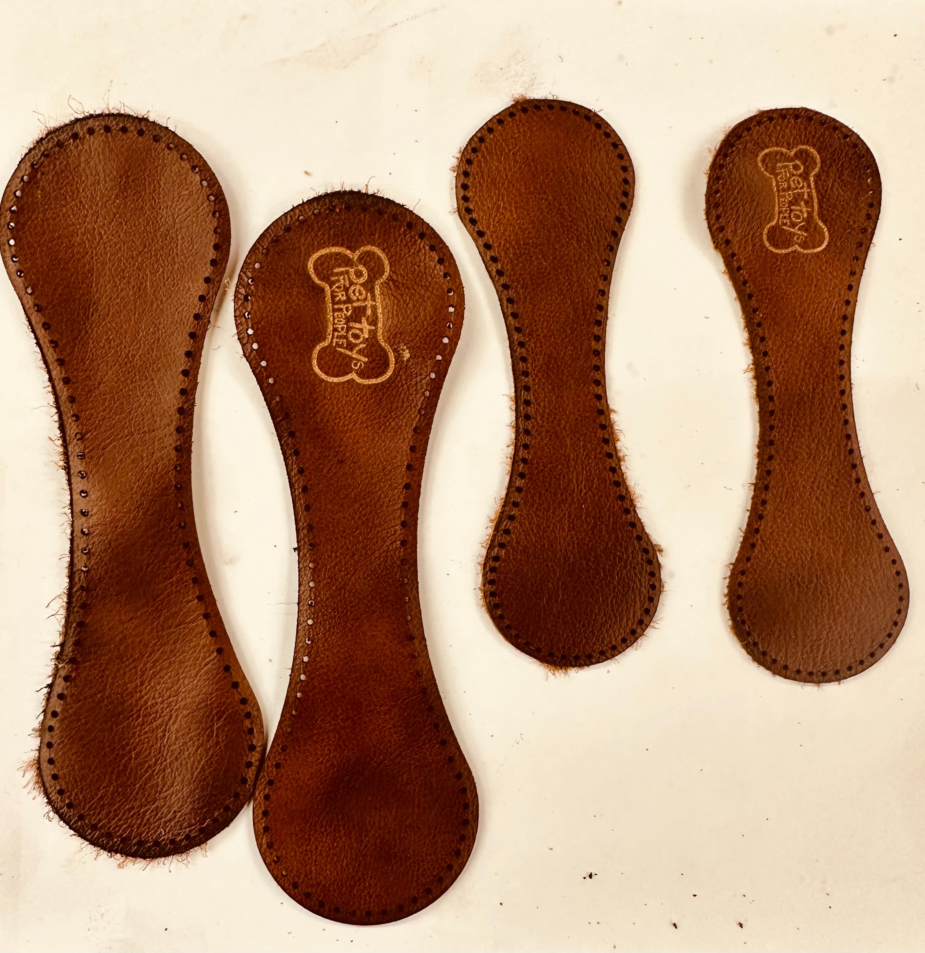 Engraved Leather Pieces — laser engraving on vegetable-tanned leather, Gainesville FL