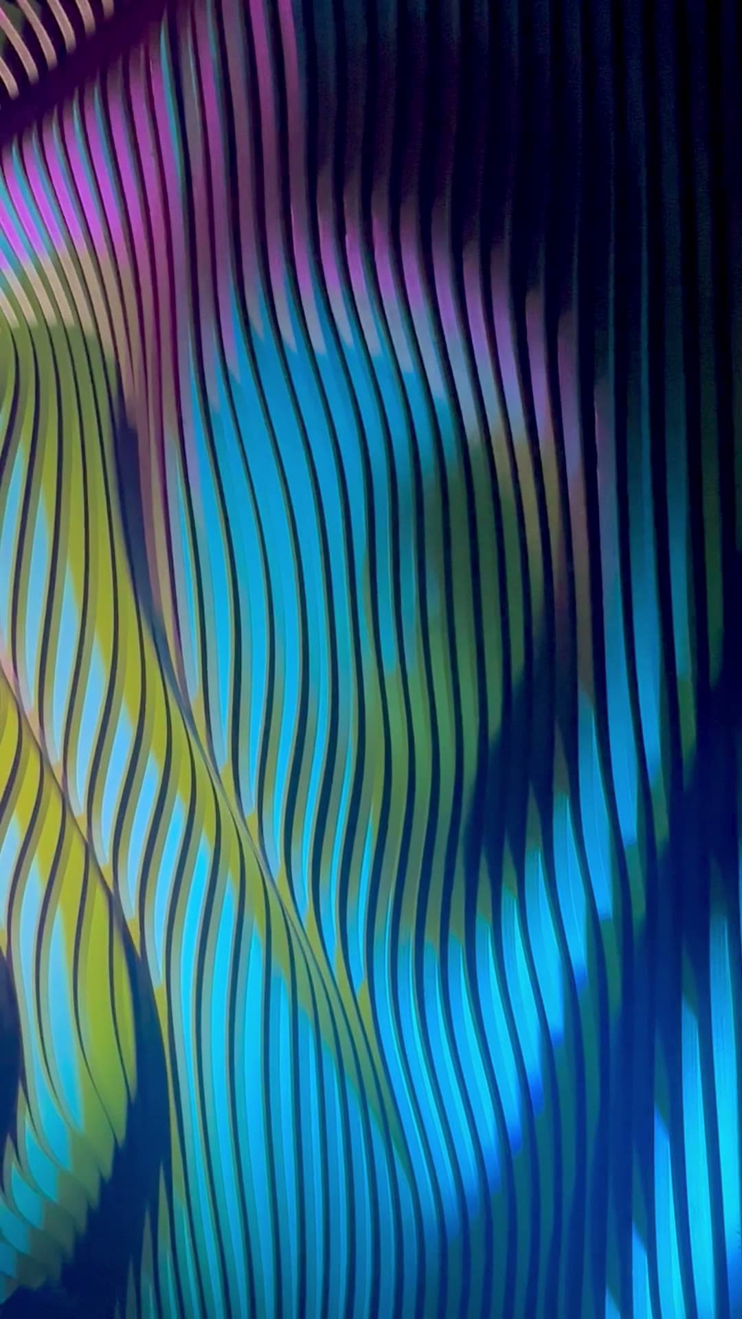 Close-up of a deep-relief parametric rib wall, eight inches of CNC-machined shadow
