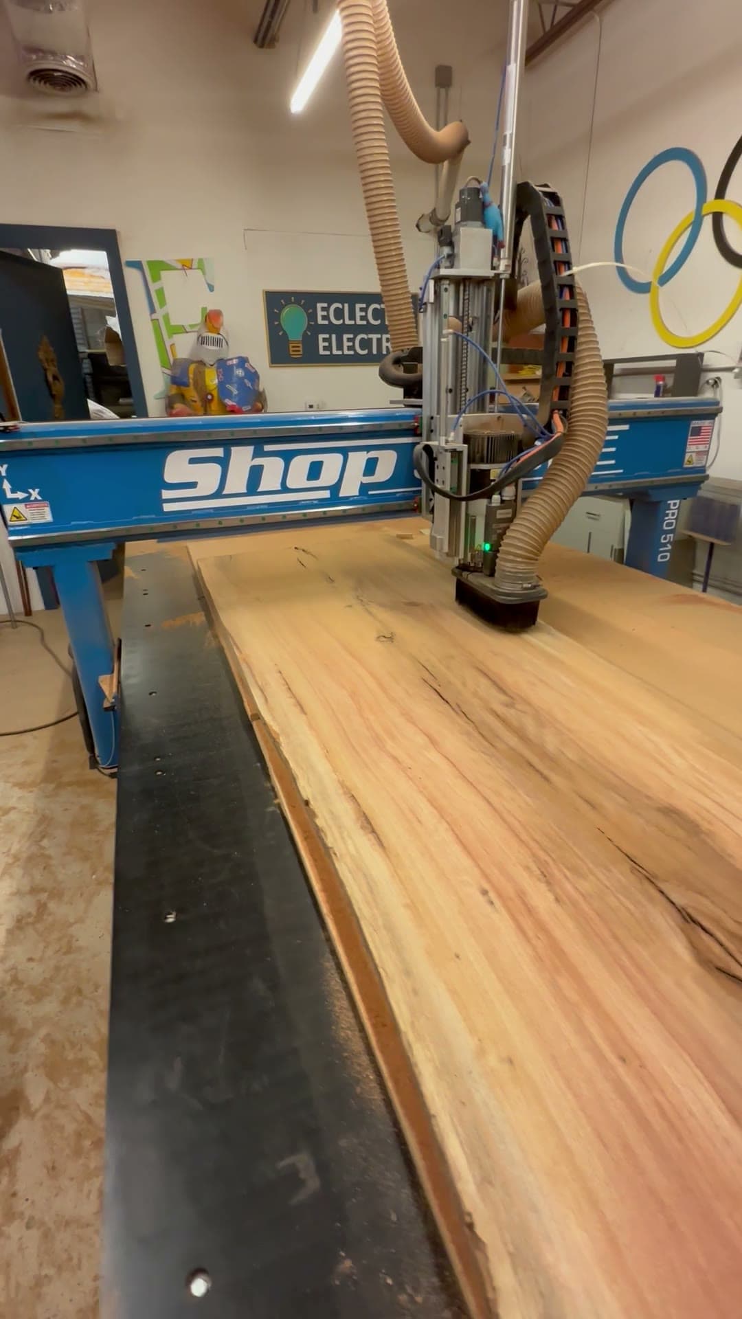 Dust plume lifting off the cutter as the ShopSabre surfaces a slab