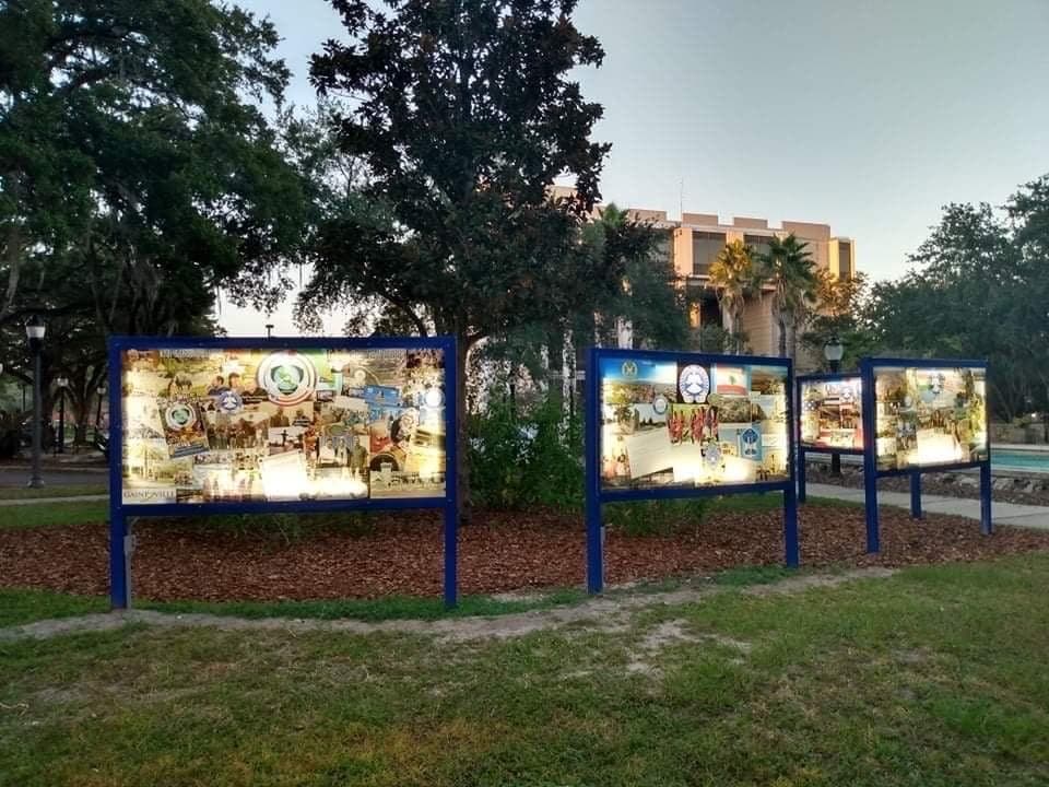 Illuminated Sister Cities civic bulletin installation at night
